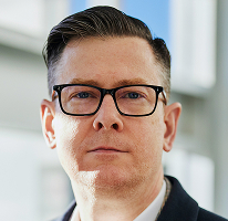 Fotografía del ejecutivo y CEO Alexander Hughes de una compañía dedicada a operaciones de criptomonedas